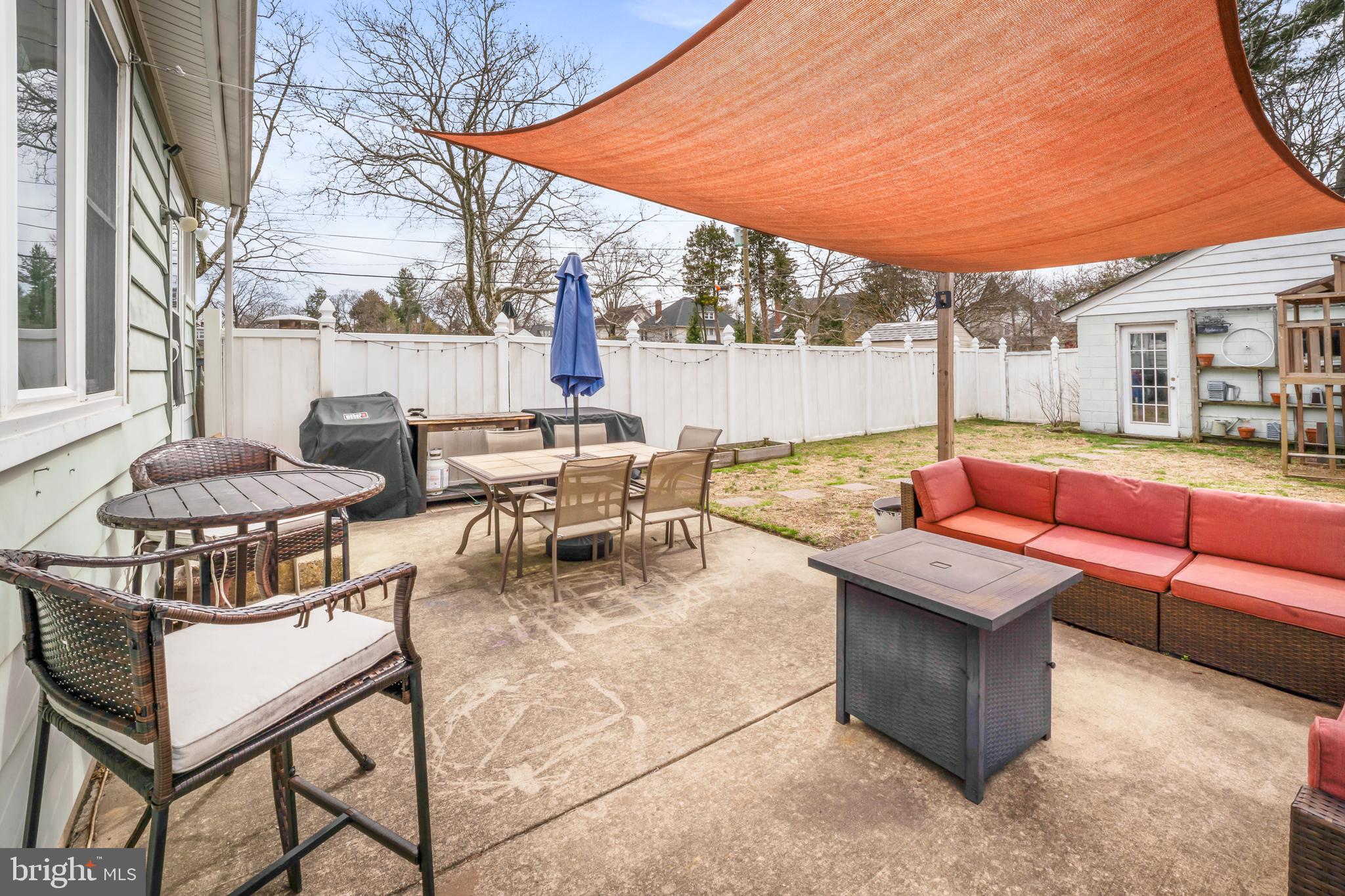 731 Washington Avenue Palmyra, NJ 08065 - Photo 34 of 40 a outdoor living space with patio furniture and a fireplace