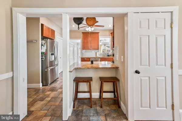 a dining room with table and chairs