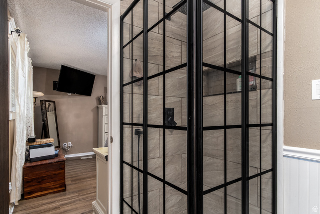 100 Third North Helper, UT 84526 - Photo 23 of 30 Modern shower enclosure featuring black-framed glass panels and large format tile