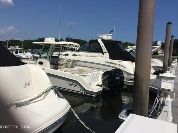 a utility room with dryer washer and a view of living room