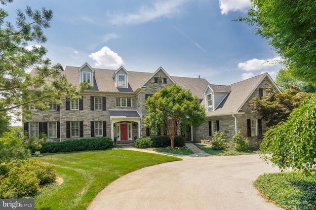 a front view of a house with a yard and porch