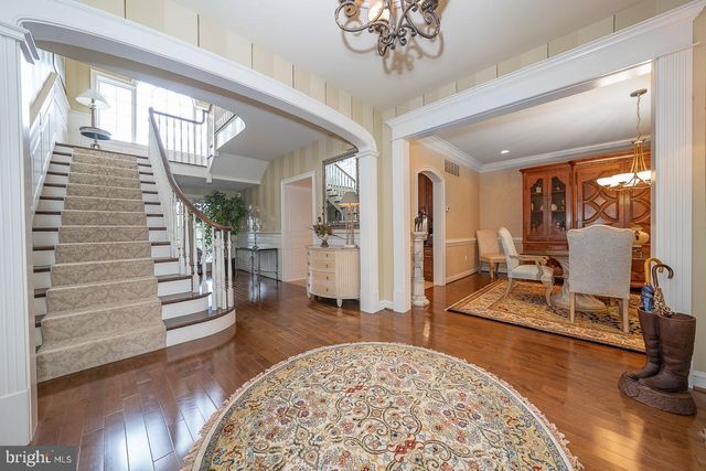 a living room with furniture fireplace and window