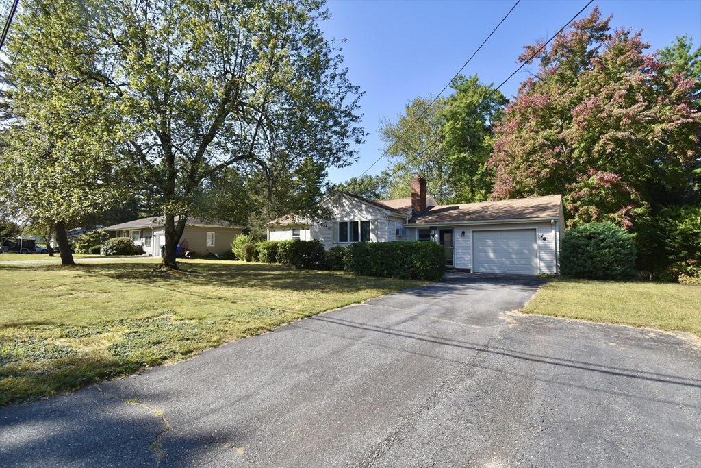 74 Blanche Street Springfield, MA 01119 - Photo 40 of 41 a front view of a house with a yard and garage