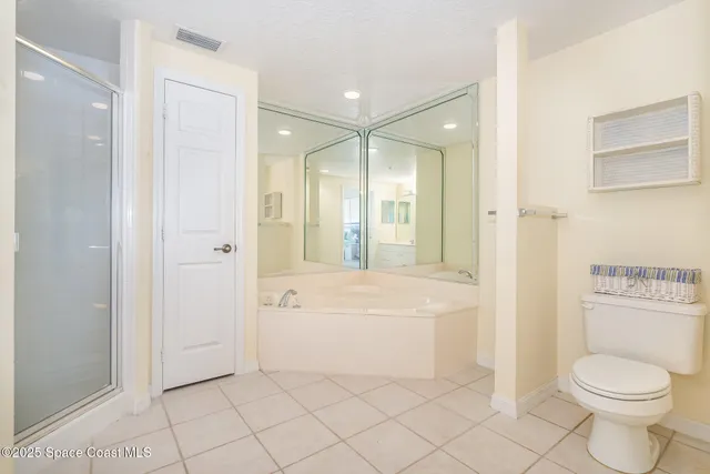 a bathroom with a toilet a sink and bathtub