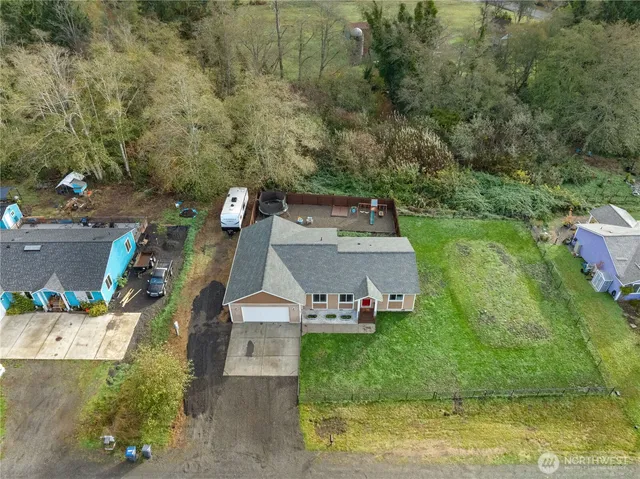 an aerial view of a house with outdoor space