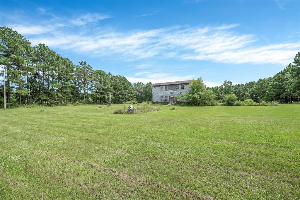 368 Sneed Road Waskom, TX 75692 - Photo 11 of 16 a view of a green field with house in the background