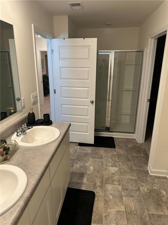 103 Hampton Street McDonough, GA 30253 - Photo 16 of 17 a bathroom with a sink and a mirror