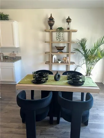 a table with a vase and flowers on it