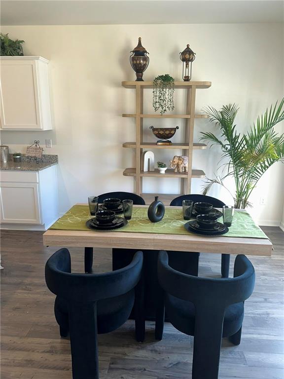 103 Hampton Street McDonough, GA 30253 - Photo 6 of 17 a table with a vase and flowers on it