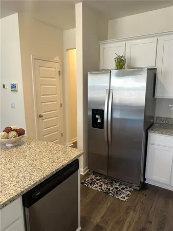 a kitchen with a refrigerator and countertop