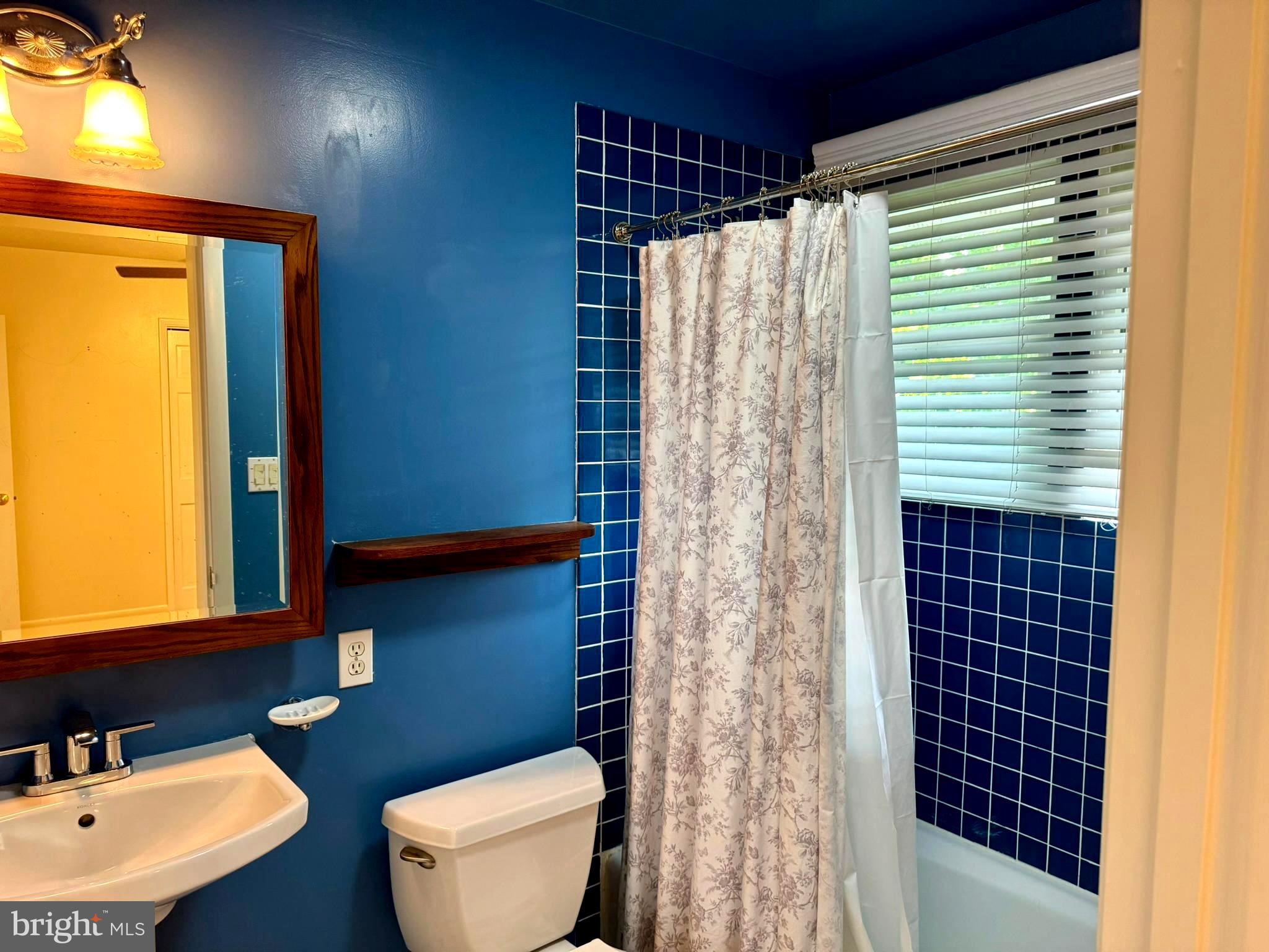 7200 Highland Street Springfield, VA 22150 - Photo 17 of 29 a bathroom with a sink toilet and shower