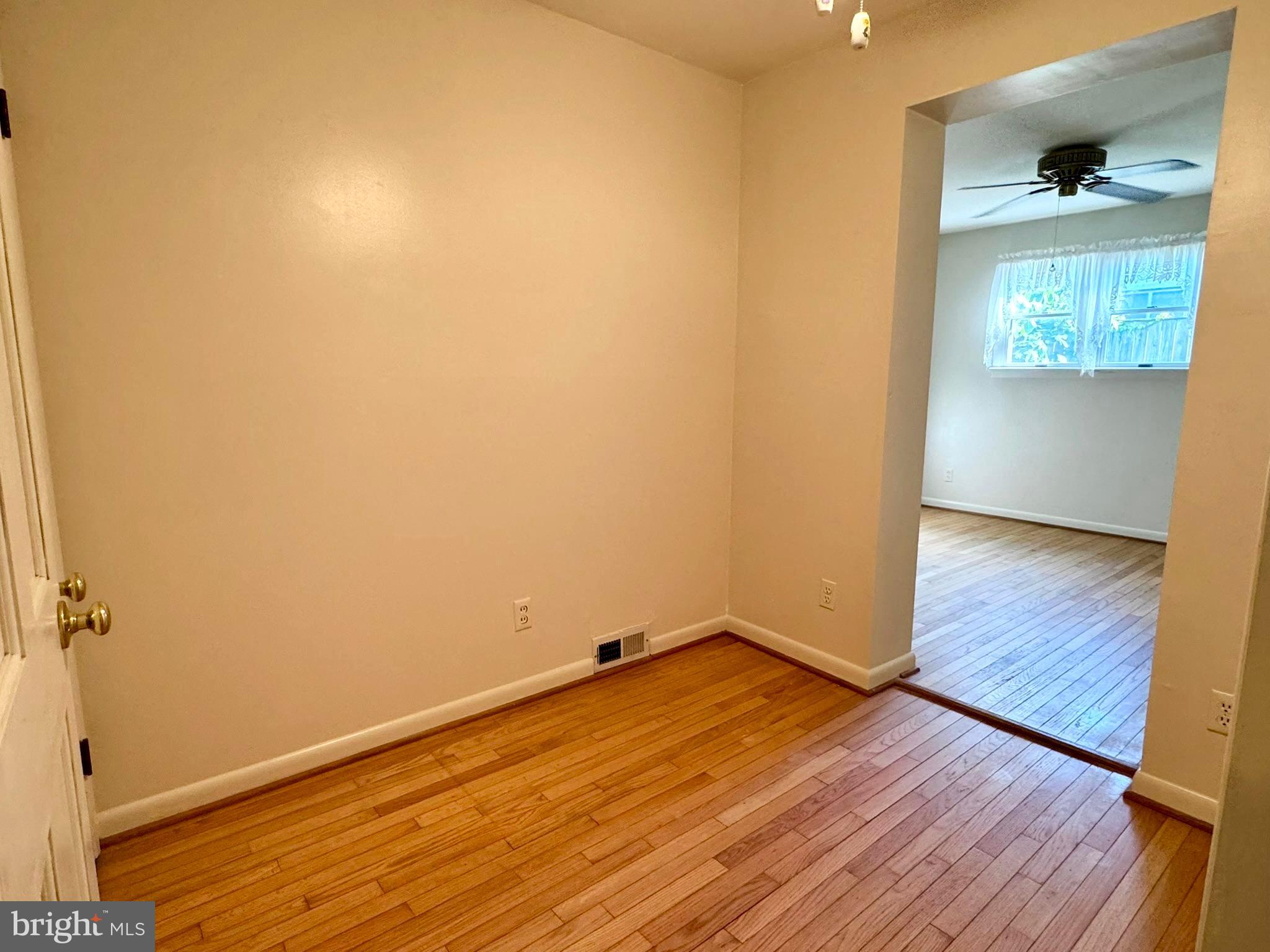 7200 Highland Street Springfield, VA 22150 - Photo 18 of 29 an empty room with wooden floor and windows