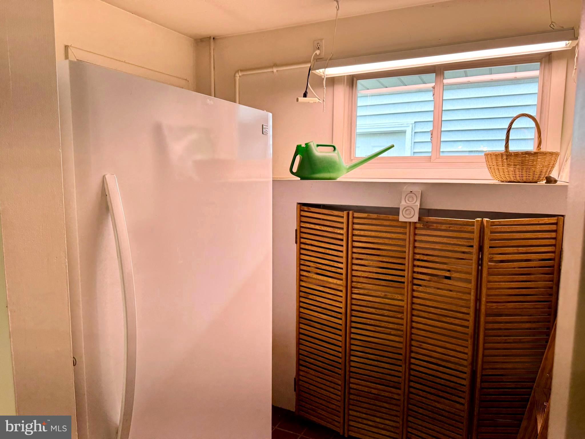 7200 Highland Street Springfield, VA 22150 - Photo 21 of 29 a view of a bathroom with a window and a shower