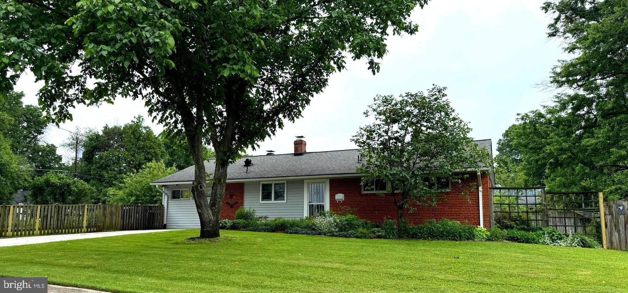 7200 Highland Street Springfield, VA 22150 - Photo 23 of 29 a front view of a house with garden