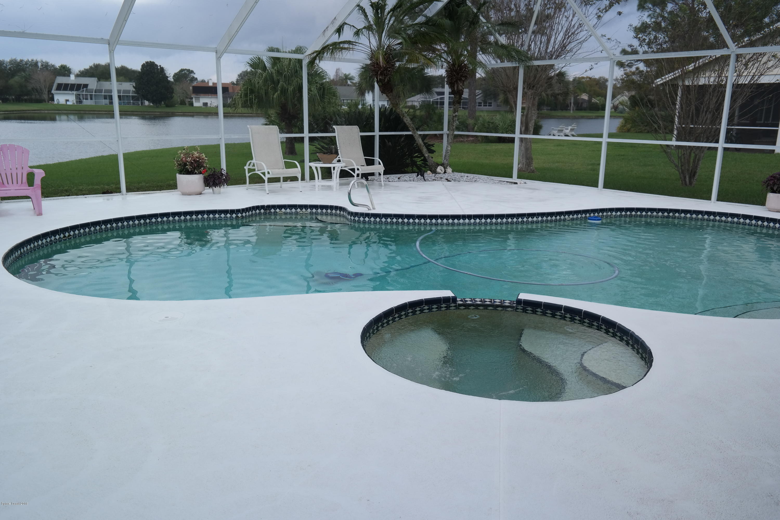 3370 Holly Springs Road Melbourne, FL 32934 - Photo 25 of 27 Pool + Hot Tub + Lake = FUN!