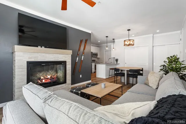 a kitchen with stainless steel appliances granite countertop a sink and a microwave