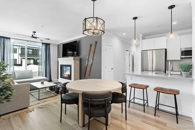 a view of a dining room with furniture window and wooden floor