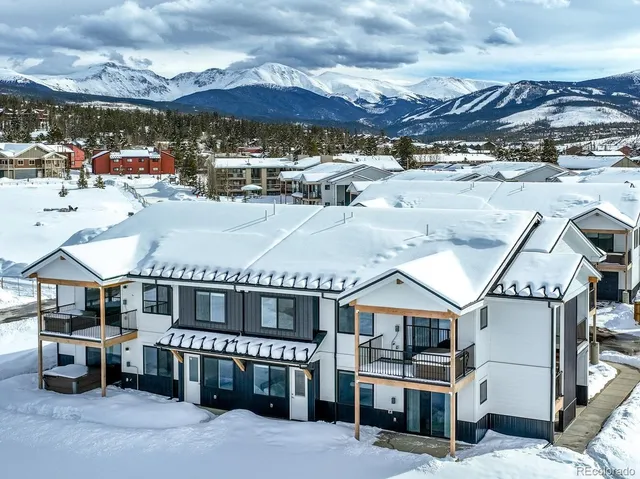 a kitchen with kitchen island a sink stove and refrigerator