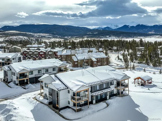 a kitchen with stainless steel appliances granite countertop a sink a refrigerator and a stove