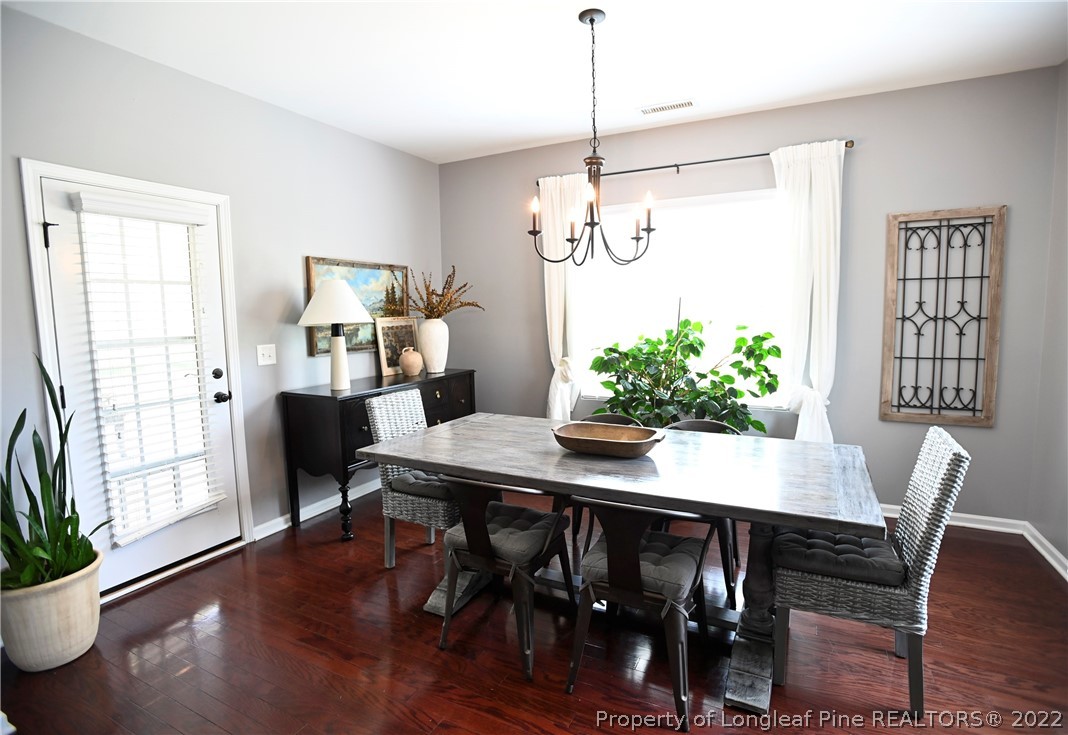 43 Lancaster Court Spring Lake, NC 28390 - Photo 11 of 44 a view of a dining room with furniture window and wooden floor