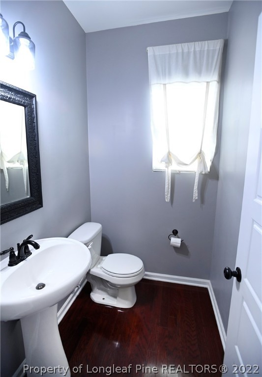43 Lancaster Court Spring Lake, NC 28390 - Photo 13 of 44 a bathroom with a sink a toilet and mirror