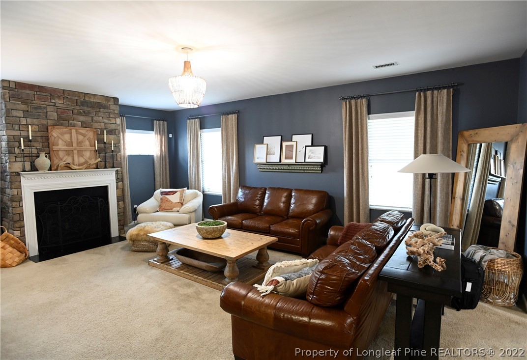 43 Lancaster Court Spring Lake, NC 28390 - Photo 14 of 44 a living room with furniture fireplace and a window