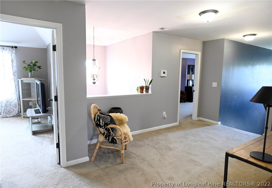 43 Lancaster Court Spring Lake, NC 28390 - Photo 19 of 44 a view of a hallway with a livingroom and a chair