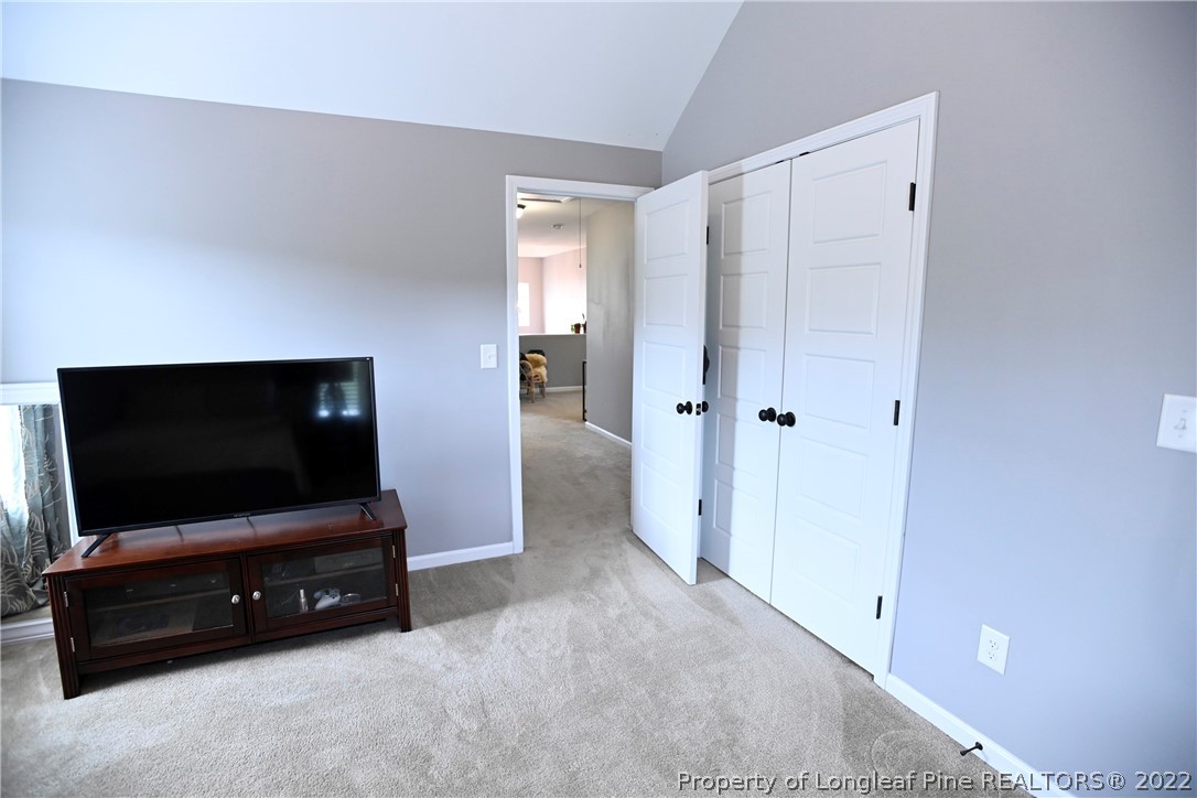43 Lancaster Court Spring Lake, NC 28390 - Photo 35 of 44 a living room with furniture and a flat screen tv