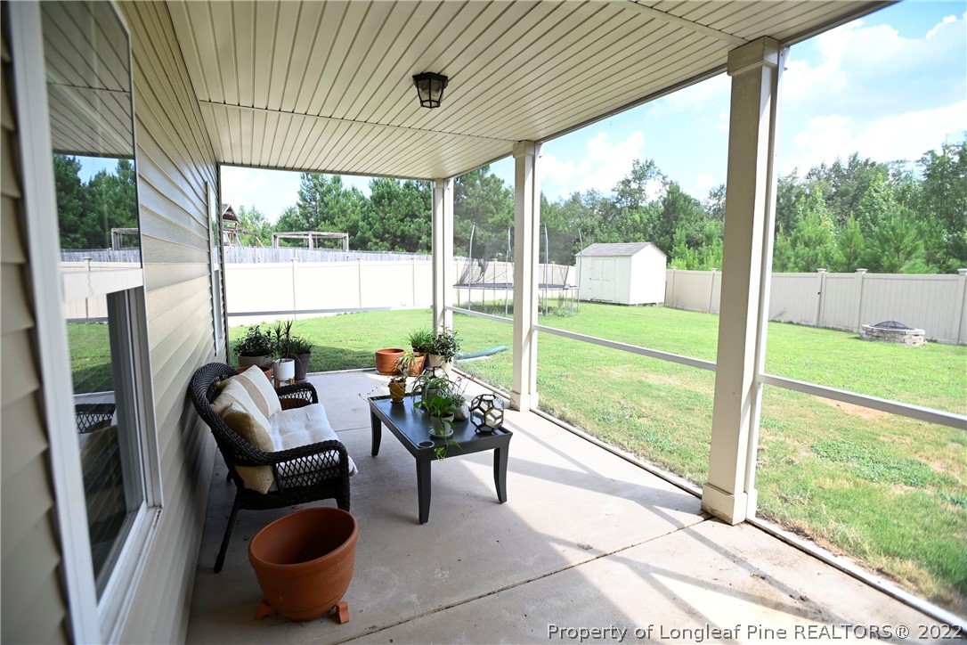 43 Lancaster Court Spring Lake, NC 28390 - Photo 37 of 44 a view of an outdoor dining space with furniture and garden