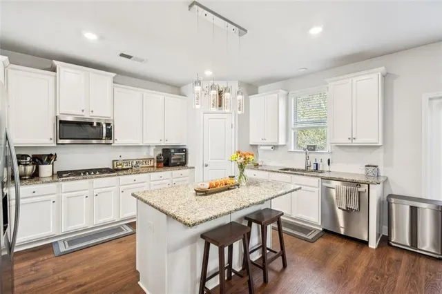 a view of a balcony with wooden floor