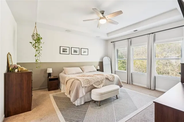 a spacious bathroom with double sink a mirror and a shower