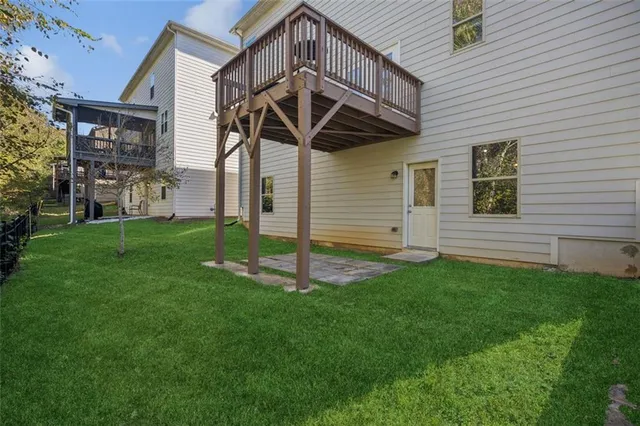 an aerial view of a house with a swimming pool