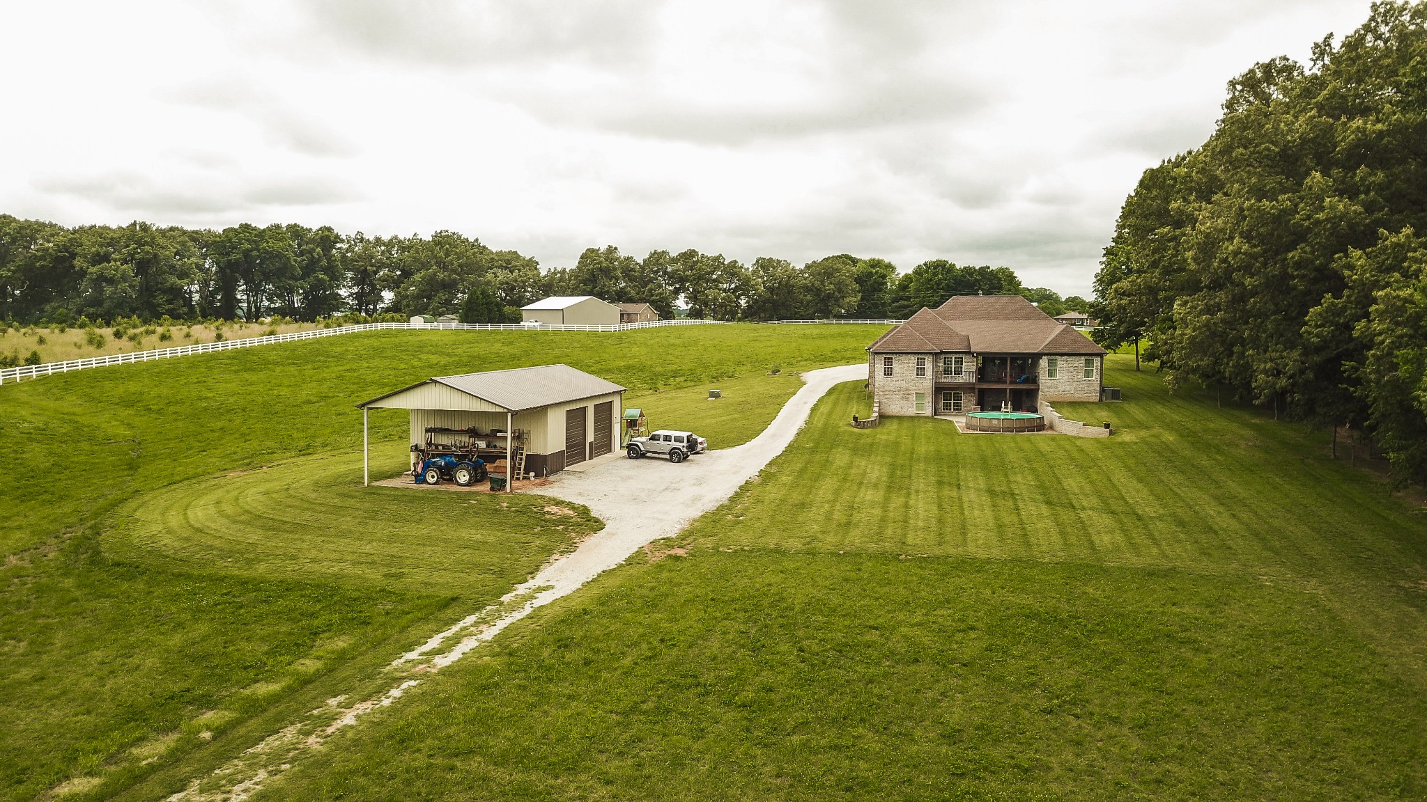 4294 Dot Road Springfield, TN 37172 - Photo 11 of 50 an aerial view of a house with swimming pool garden and tall trees