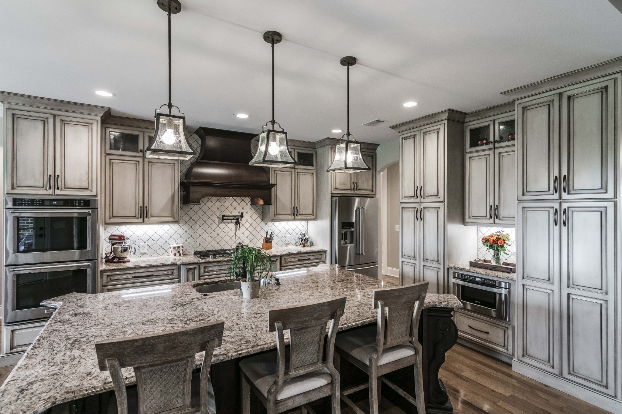 4294 Dot Road Springfield, TN 37172 - Photo 25 of 50 a kitchen with stainless steel appliances granite countertop a refrigerator a stove a kitchen island a dining table and chairs