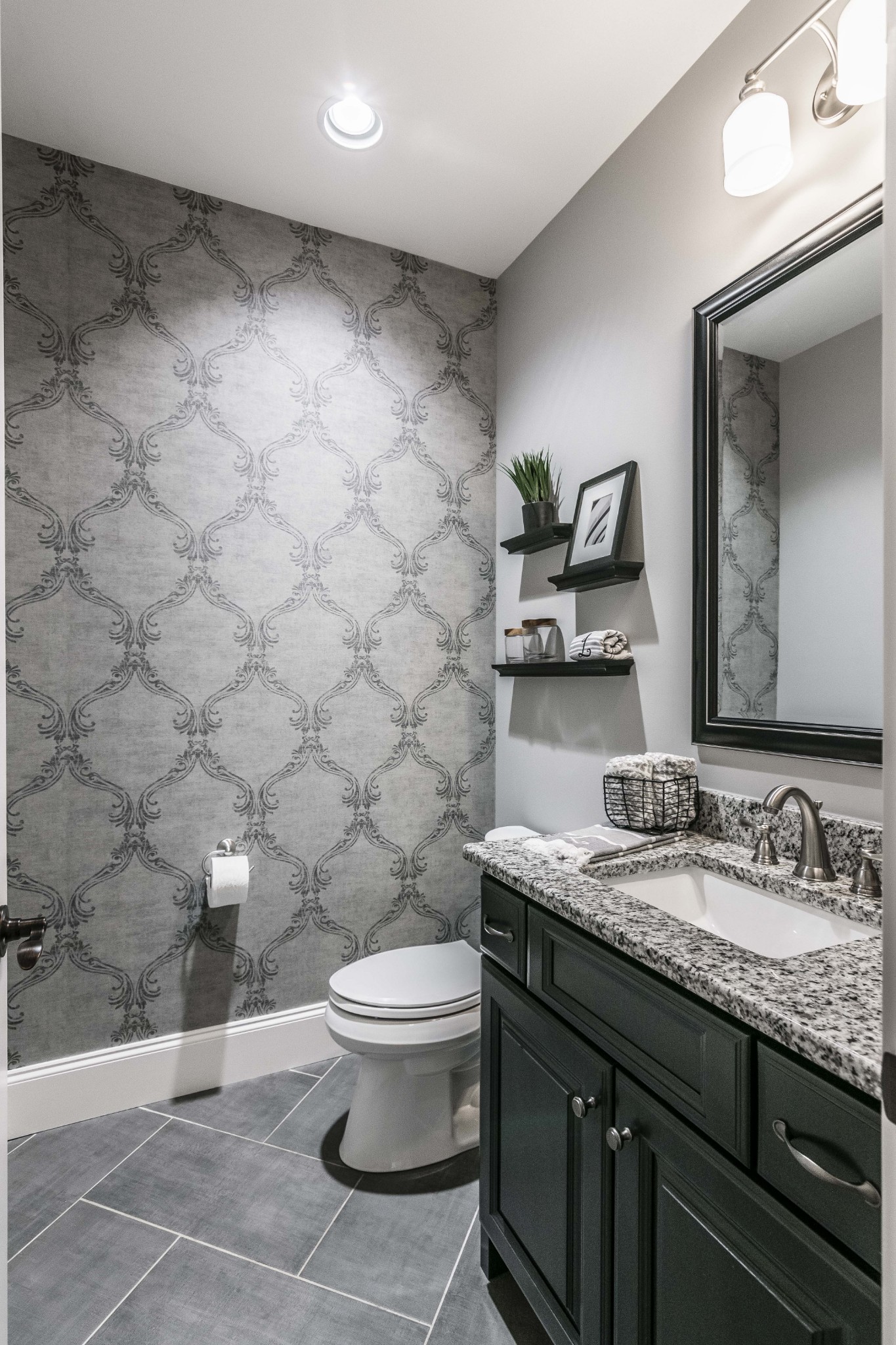 4294 Dot Road Springfield, TN 37172 - Photo 28 of 50 a bathroom with a granite countertop sink a toilet and a mirror