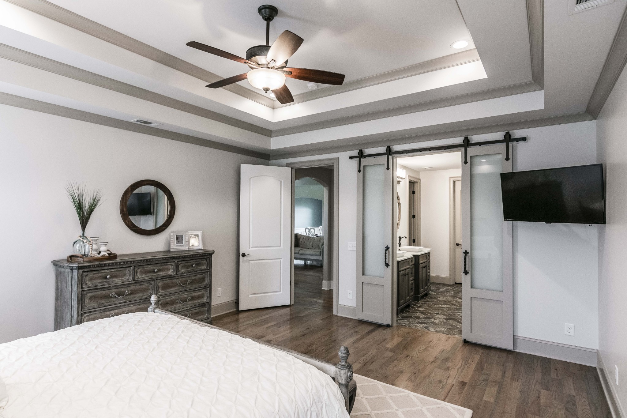4294 Dot Road Springfield, TN 37172 - Photo 35 of 50 a spacious bedroom with a bed and a chandelier
