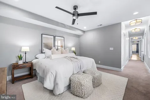 a bathroom with a granite countertop sink a mirror and shower