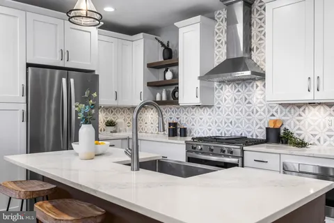 a kitchen with a sink and cabinets