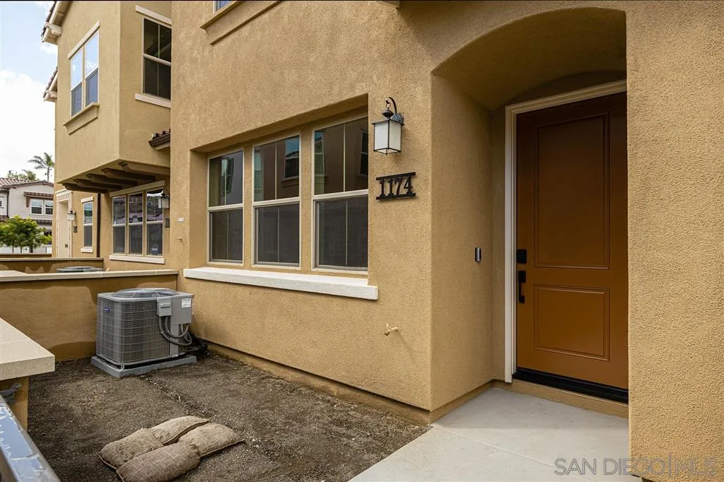 1174 Delpy View Point, Unit 102 Vista, CA 92084 - Photo 2 of 17 a view of an empty room with a window