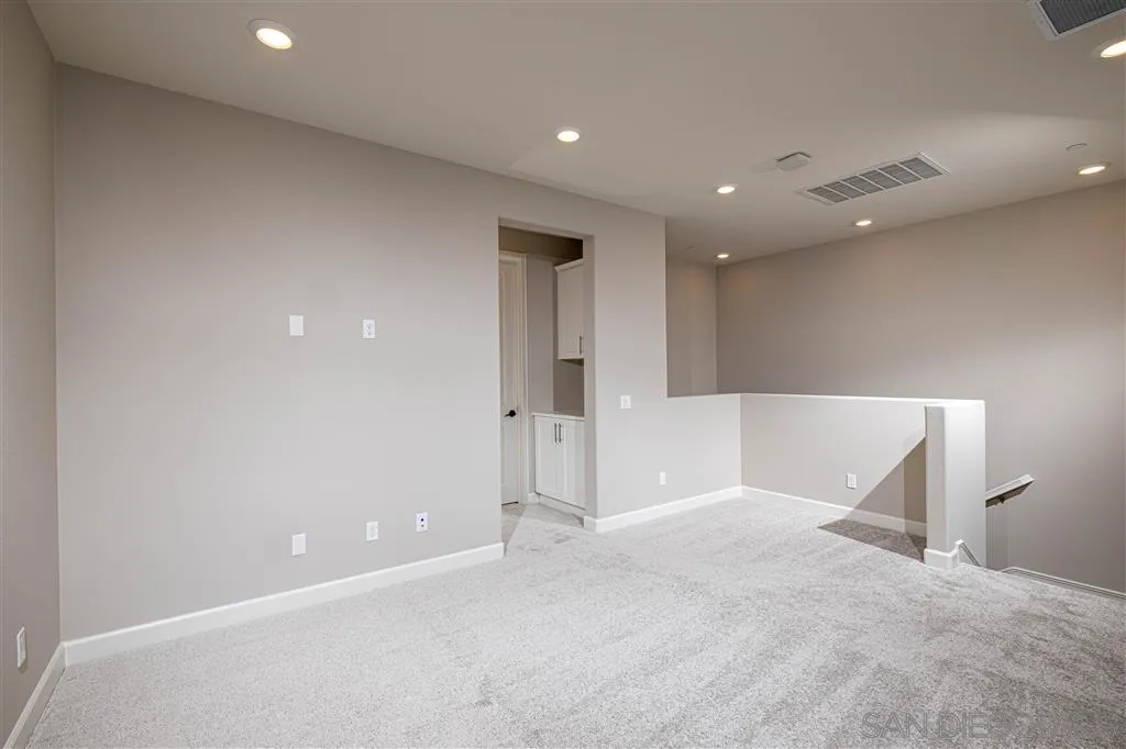 1174 Delpy View Point, Unit 102 Vista, CA 92084 - Photo 10 of 17 a view of an empty room