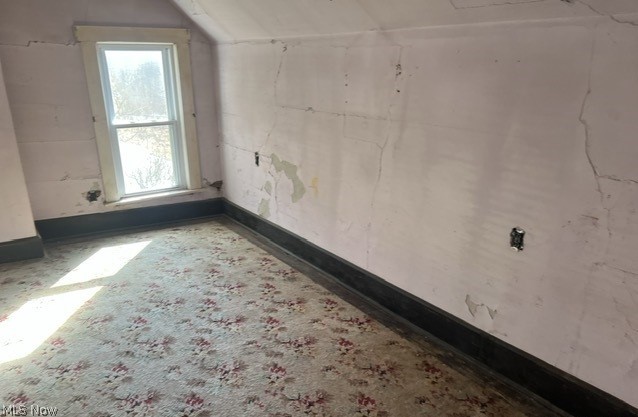 55290 Zepp Road Pleasant City, OH 43772 - Photo 4 of 8 Unfurnished room featuring vaulted ceiling