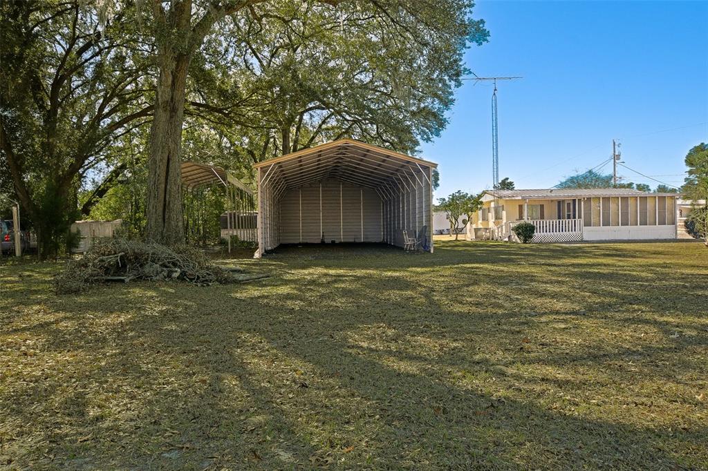 7452 Southeast 135th Street Summerfield, FL 34491 - Photo 12 of 43 a view of a house with a yard