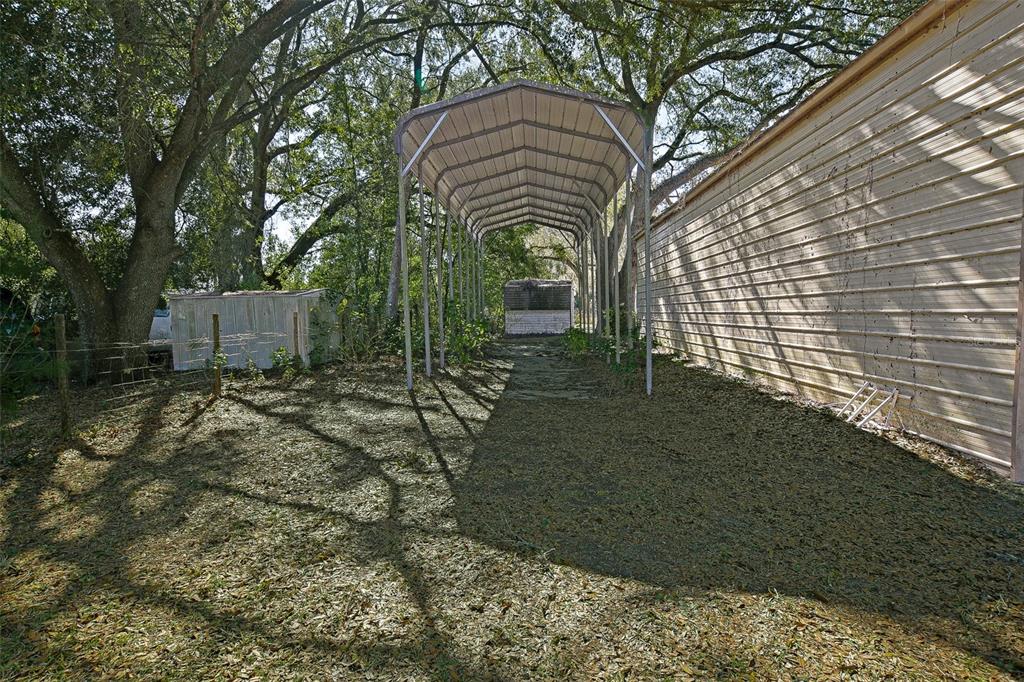 7452 Southeast 135th Street Summerfield, FL 34491 - Photo 15 of 43 a backyard of a house with lots of green space