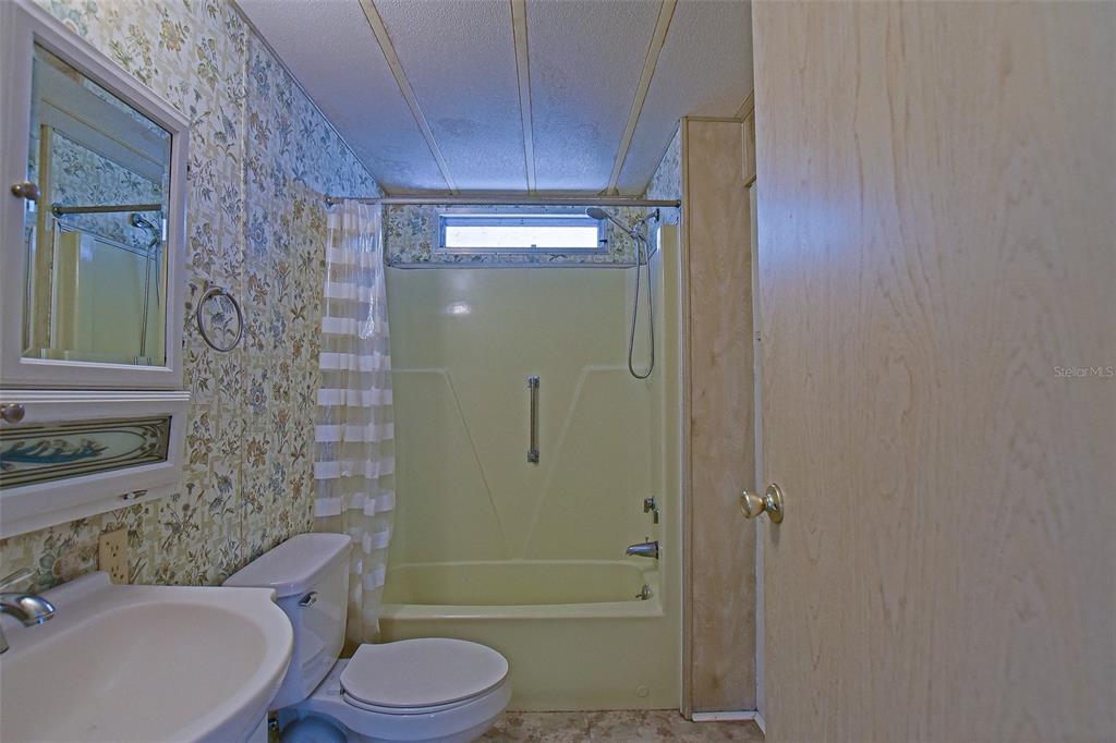 7452 Southeast 135th Street Summerfield, FL 34491 - Photo 35 of 43 a bathroom with a toilet a sink and shower