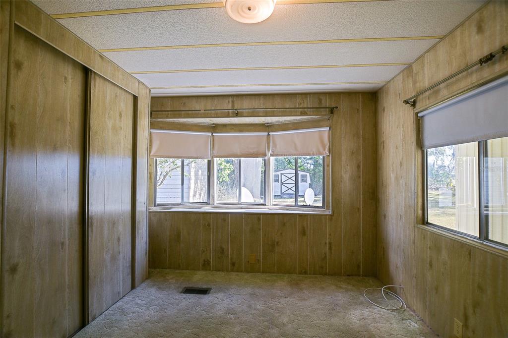 7452 Southeast 135th Street Summerfield, FL 34491 - Photo 39 of 43 a view of an empty room with a window