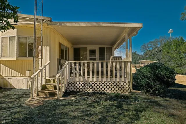 a view of a house with a small yard