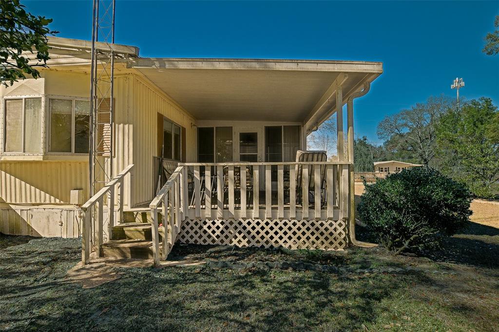 7452 Southeast 135th Street Summerfield, FL 34491 - Photo 10 of 43 a view of a house with a small yard