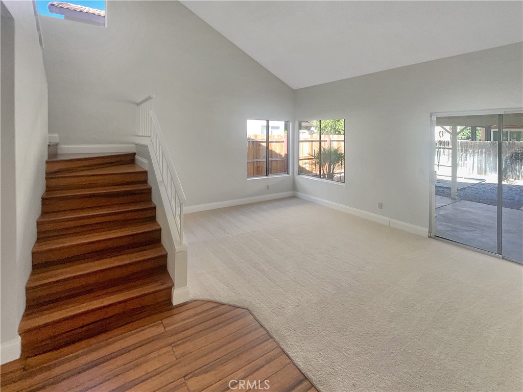 662 Spinnaker Drive Perris, CA 92571 - Photo 13 of 23 wooden floor in an empty room with a window