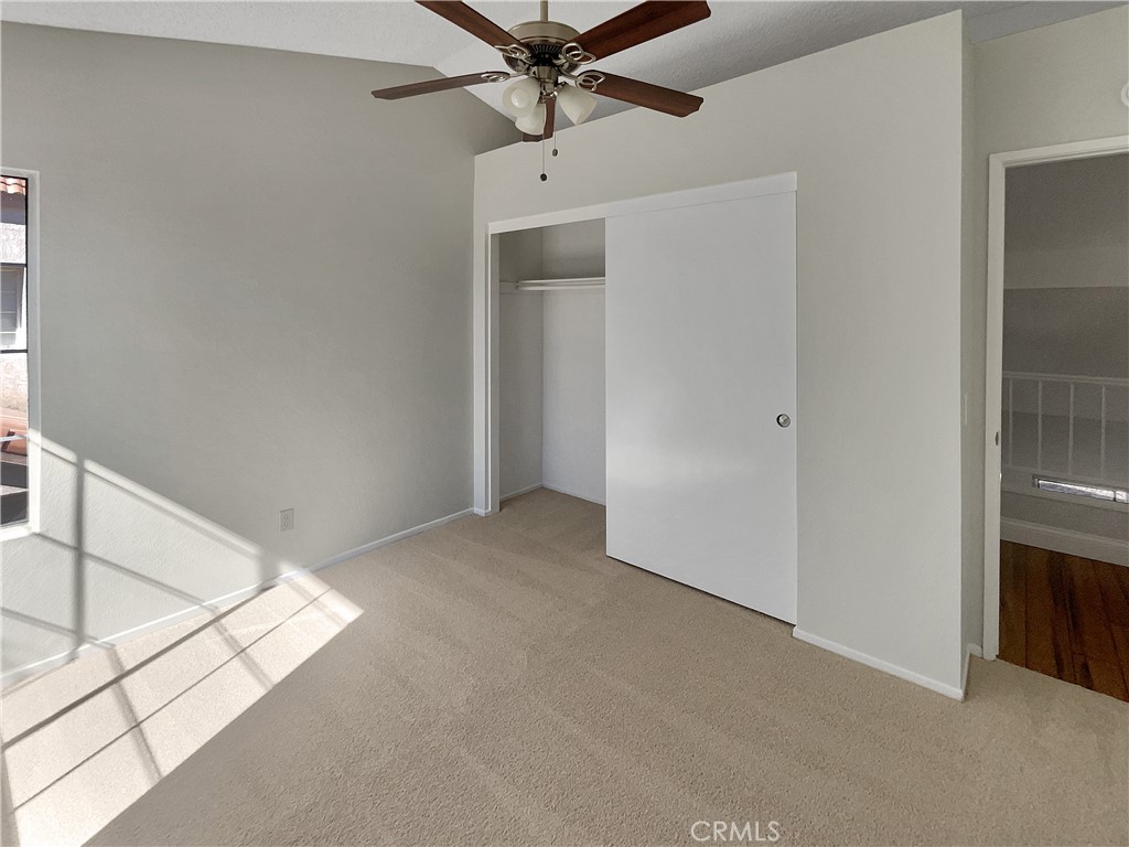 662 Spinnaker Drive Perris, CA 92571 - Photo 14 of 23 a view of a hallway with a ceiling fan