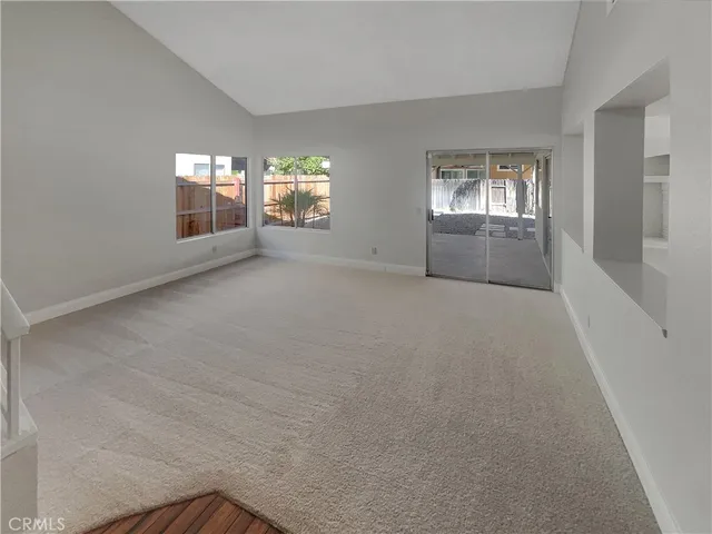 a view of entryway and hall with a window